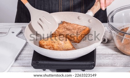 Step by step. Frying french toast in a nonstick frying pan. Royalty-Free Stock Photo #2263323149
