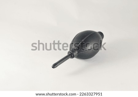 A black hand blower isolated on a white background.