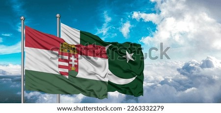 Flags of Pakistan and Hungary friendship flag waving on the sky with beautiful Sky light