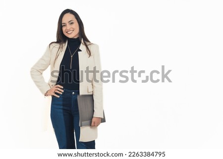 A confident young woman dressed semi-formal, holding a file applying for a new job. High-quality photo