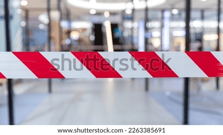 Red and White Lines of barrier tape. Striped, red and white tape that forbids passage. Red White warning tape pole fencing is protects for No entry.	 Royalty-Free Stock Photo #2263385691