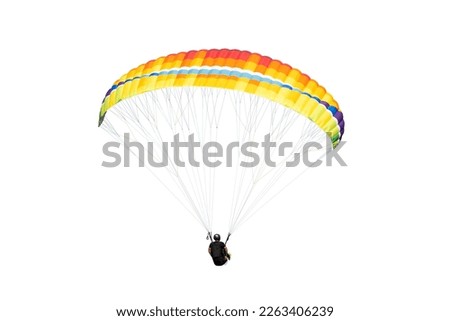 The sportsman flying on a paraglider. Beautiful paraglider in flight on a white background. isolated Royalty-Free Stock Photo #2263406239