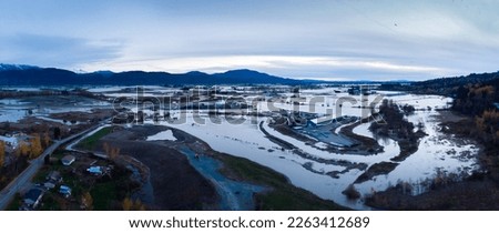 Fraser Valley farmers fields flooded from torrential rains, climate change effect, natural disaster, intense flooding, British Columbia. 4K 24FPS Royalty-Free Stock Photo #2263412689