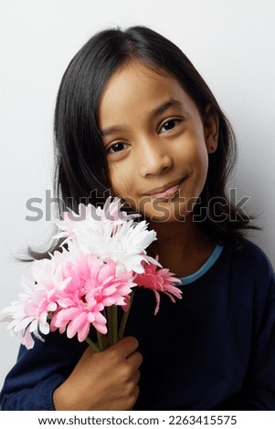 kids holding flower in selective focus 
