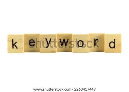 Short word english letter "Keyword"on a small wooden block isolated on white background with clipping path.Selection focus.