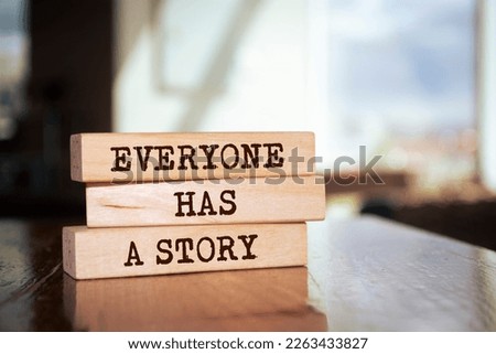 Wooden blocks with words 'Everyone Has a Story'. Royalty-Free Stock Photo #2263433827