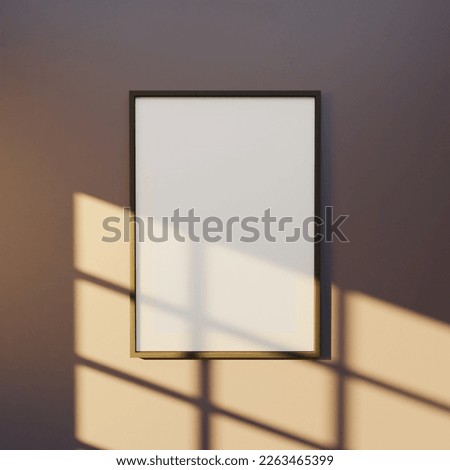 a portrait of 5x7 dark wooden frame mockup poster for your design artwork. frame mockup on the purple wall interior lit by sunlight. Minimalistic concept of home decoration.