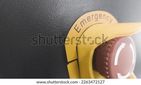 Close up the Emergency switch button and black background for space text. Safety and Protection concept.