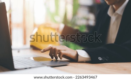 Architects use laptops to detail their work, hard safety helmet on table, protection against danger, Work Safety Concept ,safety care from an accident, prevention of possible injuries, safety first, Royalty-Free Stock Photo #2263493467