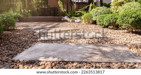 Stone block walk way on gravel stone floor Royalty-Free Stock Photo #2263513817