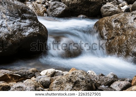 Immersed in Natural Beauty: Slow Shutter Speed Pictures of Water Flowing Through Rocks