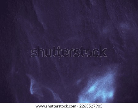The purple light reflects on the dark black tiles for a strong power abstract background.