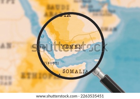 A Magnifying Glass on Yemen of the World Map Royalty-Free Stock Photo #2263535451