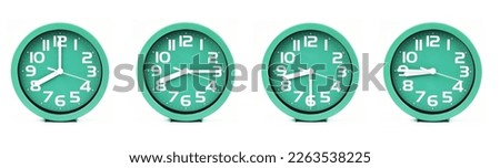 close up of a set of green clocks showing the time; 8, 8.15, 8.30 and 8.45 p.m or a.m. Isolated on white background