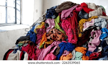 The environmental costs of fast fashion. The pollution, waste, and emissions of fast fashion, planetary crisis. High quality photo Royalty-Free Stock Photo #2263539065