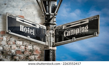 Street Sign the Direction Way to Camping versus Hotel