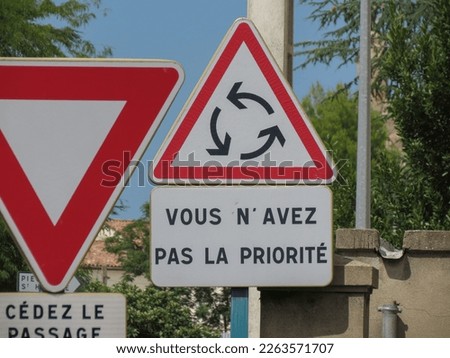 Regulatory signs, give way or yield traffic sign written in French: Vous n'avez pas la priorité translated You do not have any priority rights