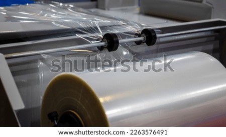 Conveyor Belt For Packaging In Transparent Polythene Stretch. Concept Of Industrial Technologies And Packaging Materials.