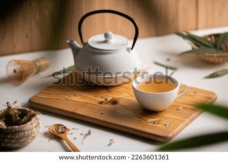 Japanese tea infusion, green tea on a wooden table Royalty-Free Stock Photo #2263601361