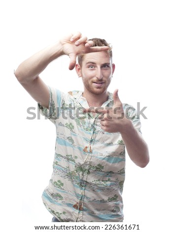 ginger young man with hawaiian shirt frame with his hands