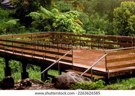 wooden balcony in the park after pouring rain photo