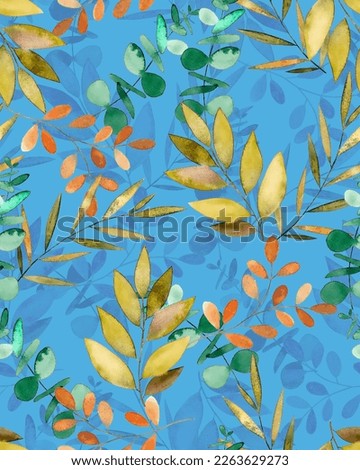 A few leaves of bright color with shadow on a blue background