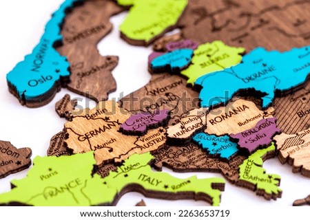 the country of Germany on the world map, wooden volumetric world map on a white background macro, close-up, shallow depth of field