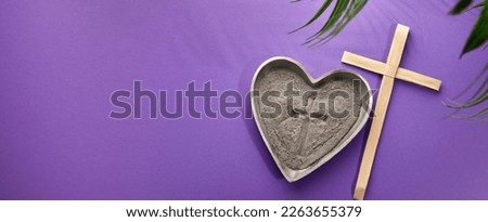 Ash Wednesday, Lent Season and Holy Week concept. Christian crosses and ashes on purple background. Royalty-Free Stock Photo #2263655379