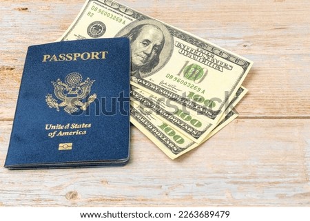 USA passport and 100 dollar notes. Top wiew. Copy space. Recreational and business travel concept.
