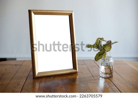 picture frame mock up on wood table natural style clean close up