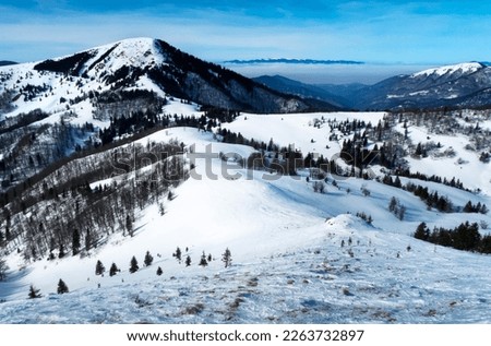 seasonal View from the mountain on the winter mountainous landscape