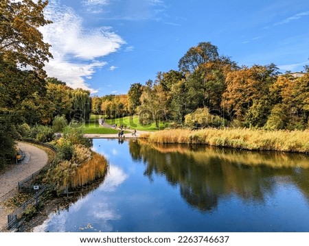 View from the Carl Zuckmayer Bridge to the Rudolph Wilde Park with duck pond and lawn in Berlin Schöneberg Royalty-Free Stock Photo #2263746637