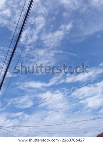 Portrait power lines, early in the morning , beautiful view of power lines under the sky and clouds , Electric cables and poles in residential areas of Bandung West Java, Indonesia