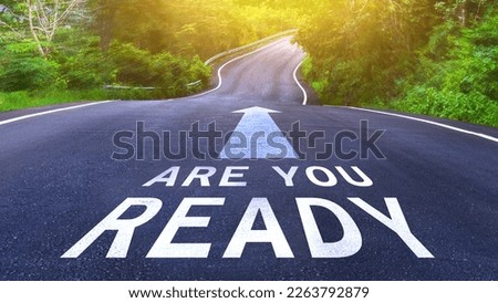 Are you ready written on the middle of the asphalt curve road. Are you ready Write on the road in the middle of the empty asphalt road Royalty-Free Stock Photo #2263792879