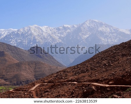 Panoramic view of snow-capped High Atlas Mountains in Ourika valley, Morocco. High quality photo