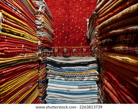 Pile of colorful Berber Carpets in Marrakech, Morocco. High quality photo
