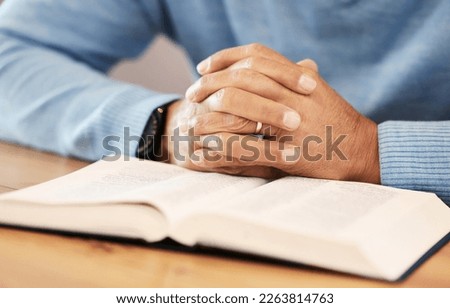 Praying, hands closeup and bible religion, faith and god knowledge, studying or research. Prayer, hope and christian person with holy book for learning, analysis and spiritual education or scripture Royalty-Free Stock Photo #2263814763