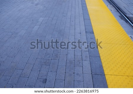 Yellow dot paving for blind passengers at stain station