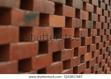 Brown bricks arranged in a zigzag manner.