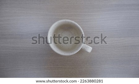 Empty cup on wooden table.Flat lay photography.Clay art.