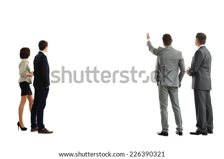 four business mans from the back - looking at something over a white background  Royalty-Free Stock Photo #226390321