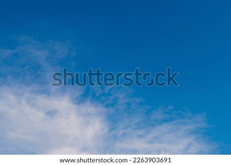 Summer cloudy blue sky background. Panoramic view with beautiful clouds. Horizontal cloudscape. Design element. Copy space.