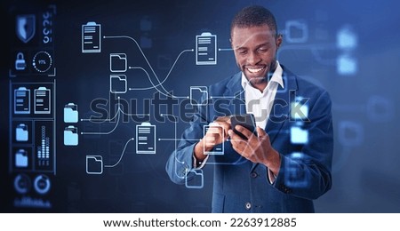 Black smiling businessman working with smartphone, online documentation database and files storage hud. Concept of digital information and mobile app