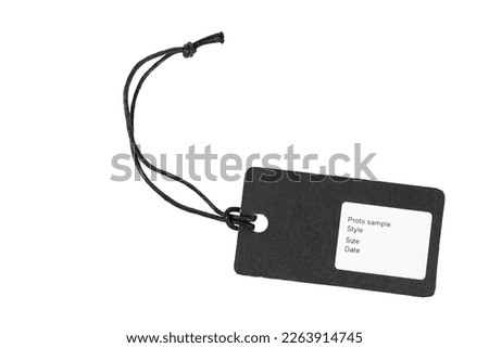 Blank tag tied for hang on product for show price or discount on a white isolated background. File contains clipping path.