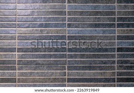 texture of dark gray, black and blue ceramic tiles 