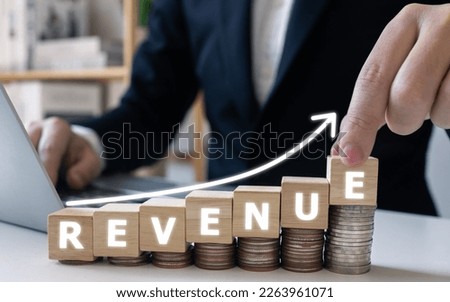 Businessman touch Revenue growth rate increase concept.Chart diagram and growing arrow, development to success, asset fund invesment. Royalty-Free Stock Photo #2263961071