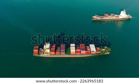 two cargo container ship sailing in sea to import export goods and distributing products to dealer and consumers across worldwide, by container ship Transportation, aerial photography from drone,