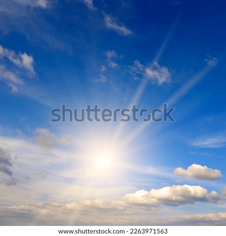 Blue sky , sun and beautiful natural clouds.