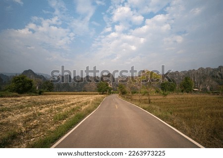 View of a country road leading to the mountains