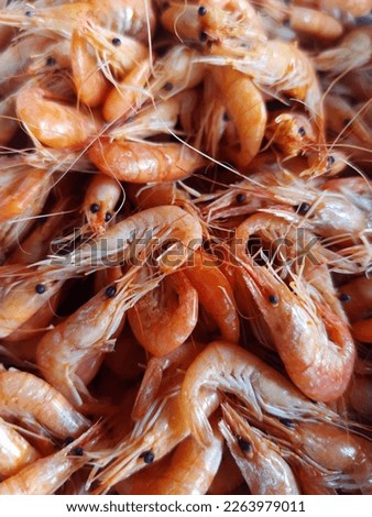Small sea shrimps on the table close-up.